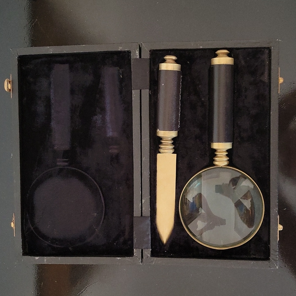 Vintage brass and leather magnifying glass and letter opener in case.